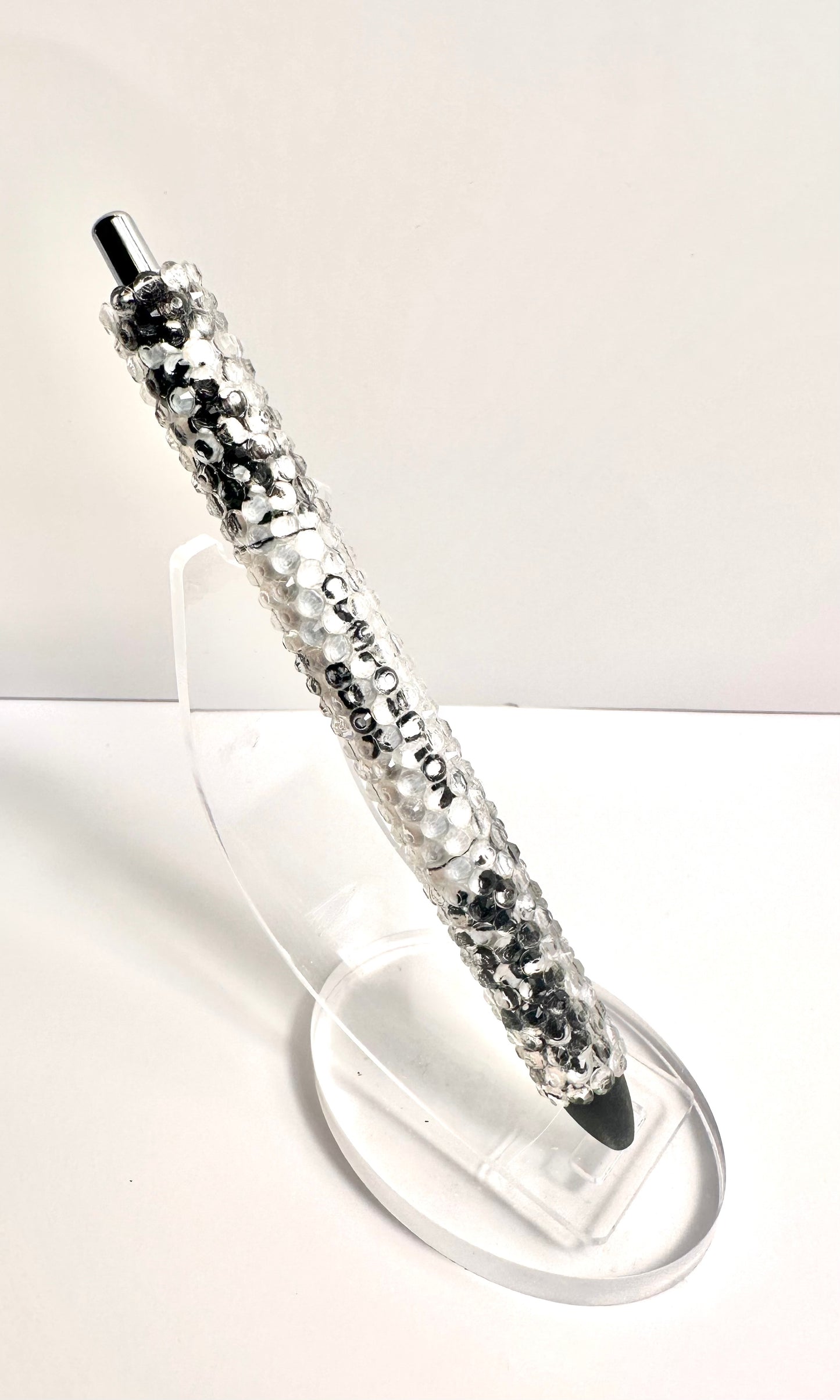 Black composition notebook rhinestone pen