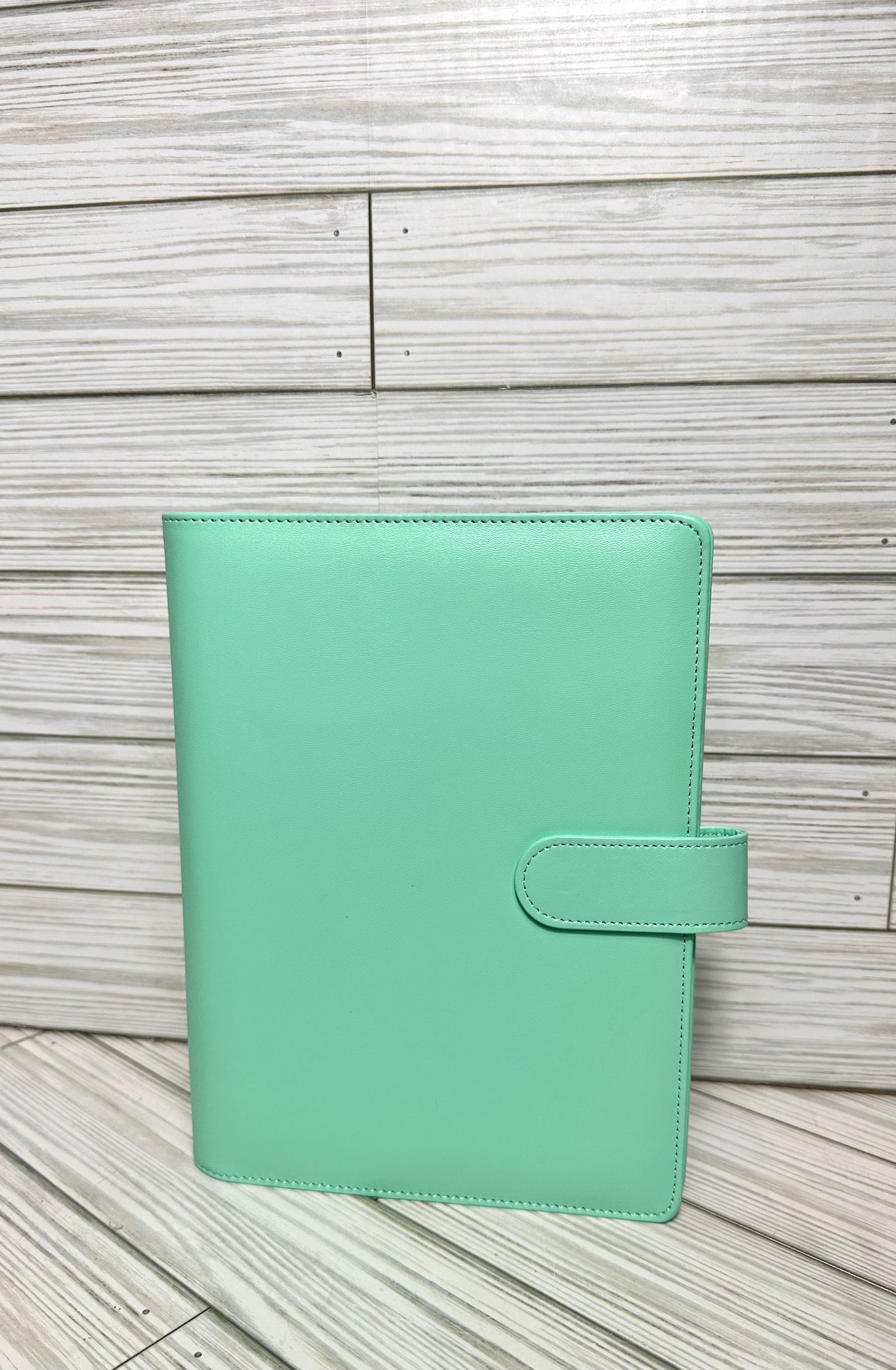 A6 Binders (7.48” lenght by 5.2” width) with your choice of vinyl and rhinestones.