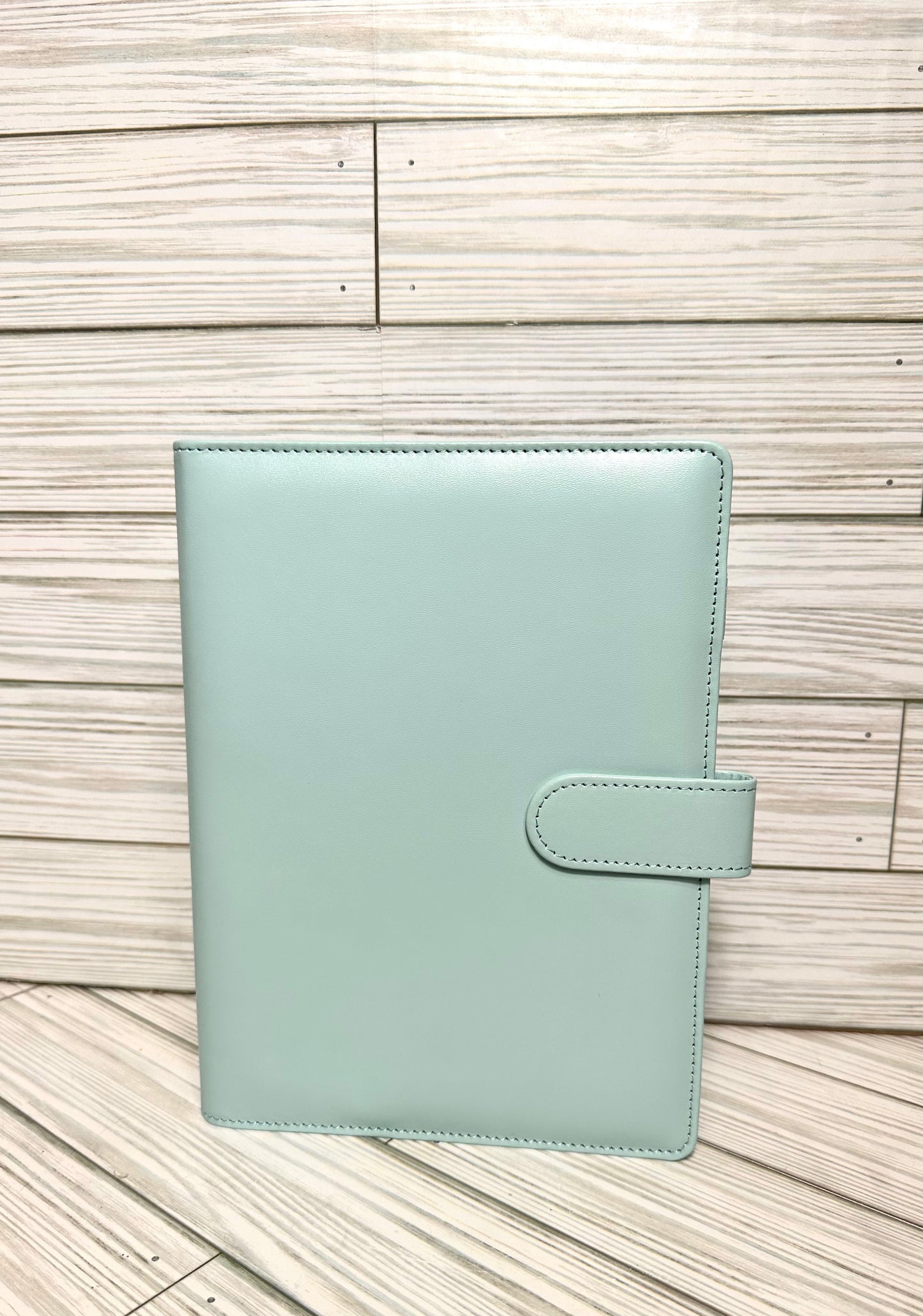 A6 Binders (7.48” lenght by 5.2” width) with your choice of vinyl and rhinestones.