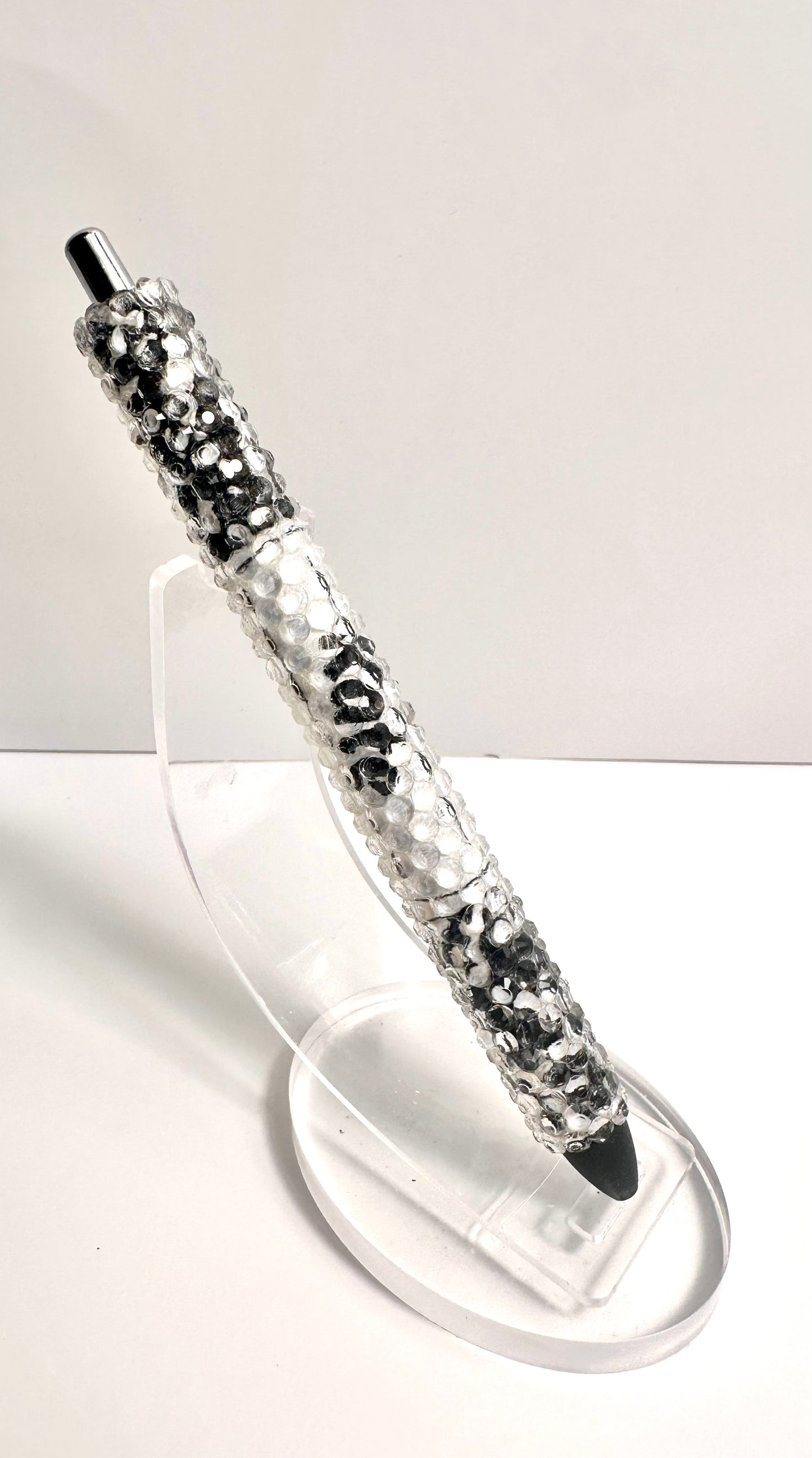 Black composition notebook rhinestone pen