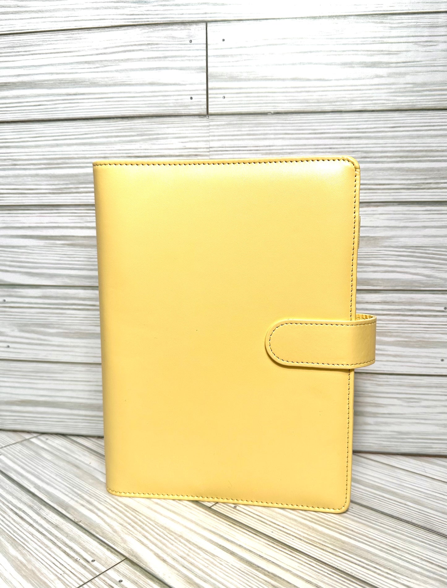 A6 Binders (7.48” lenght by 5.2” width) with your choice of vinyl and rhinestones.