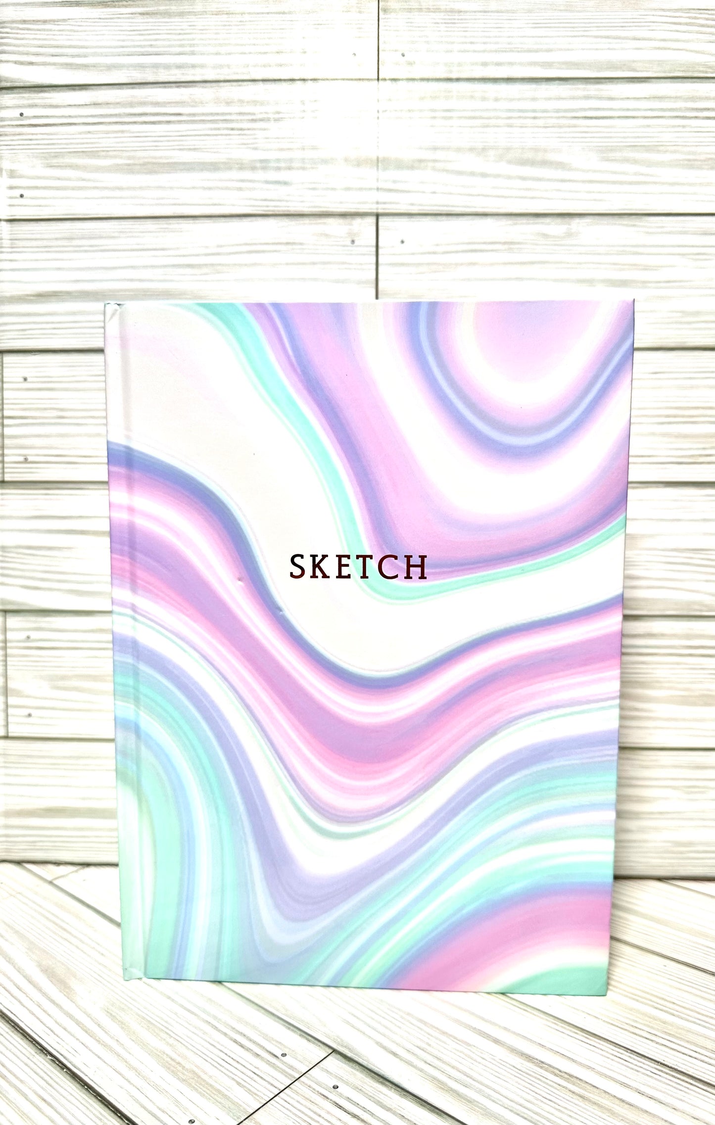Sketch book 12” in x9” in .Blank drawing paper inside.